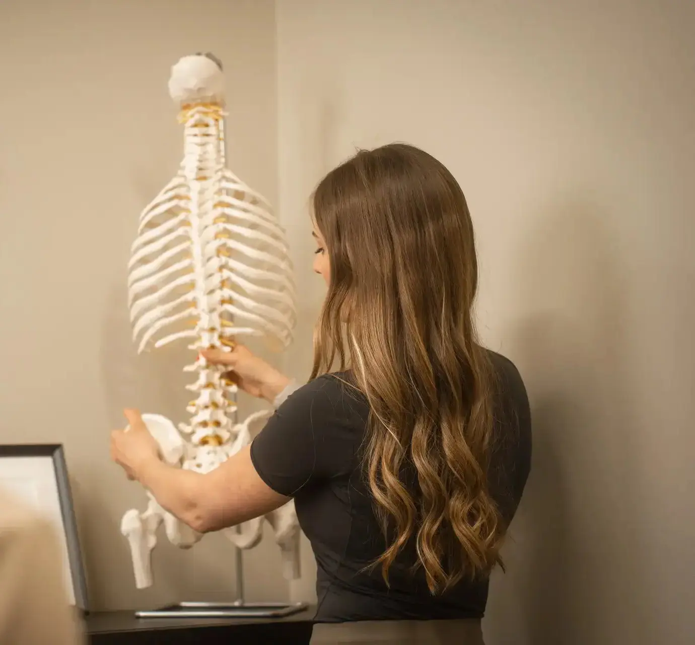 Paige Thomson teaching with the spine model
